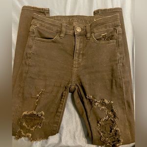 American Eagle ripped skinny jeans in size 0 short. Rips on both legs.